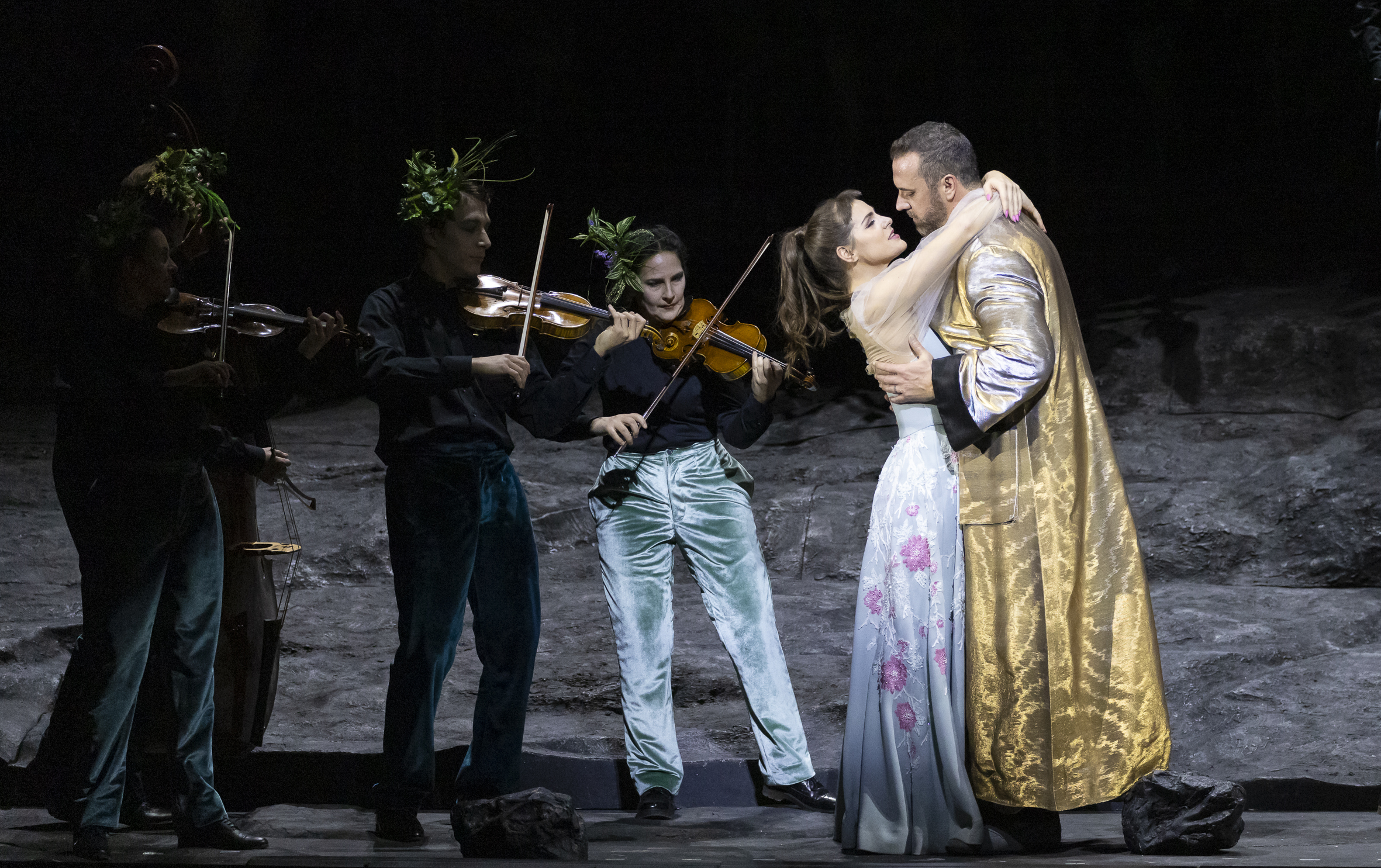 Christian Van Horn in a gold coat in a Don Giovanni scene at the Vienna State Opera