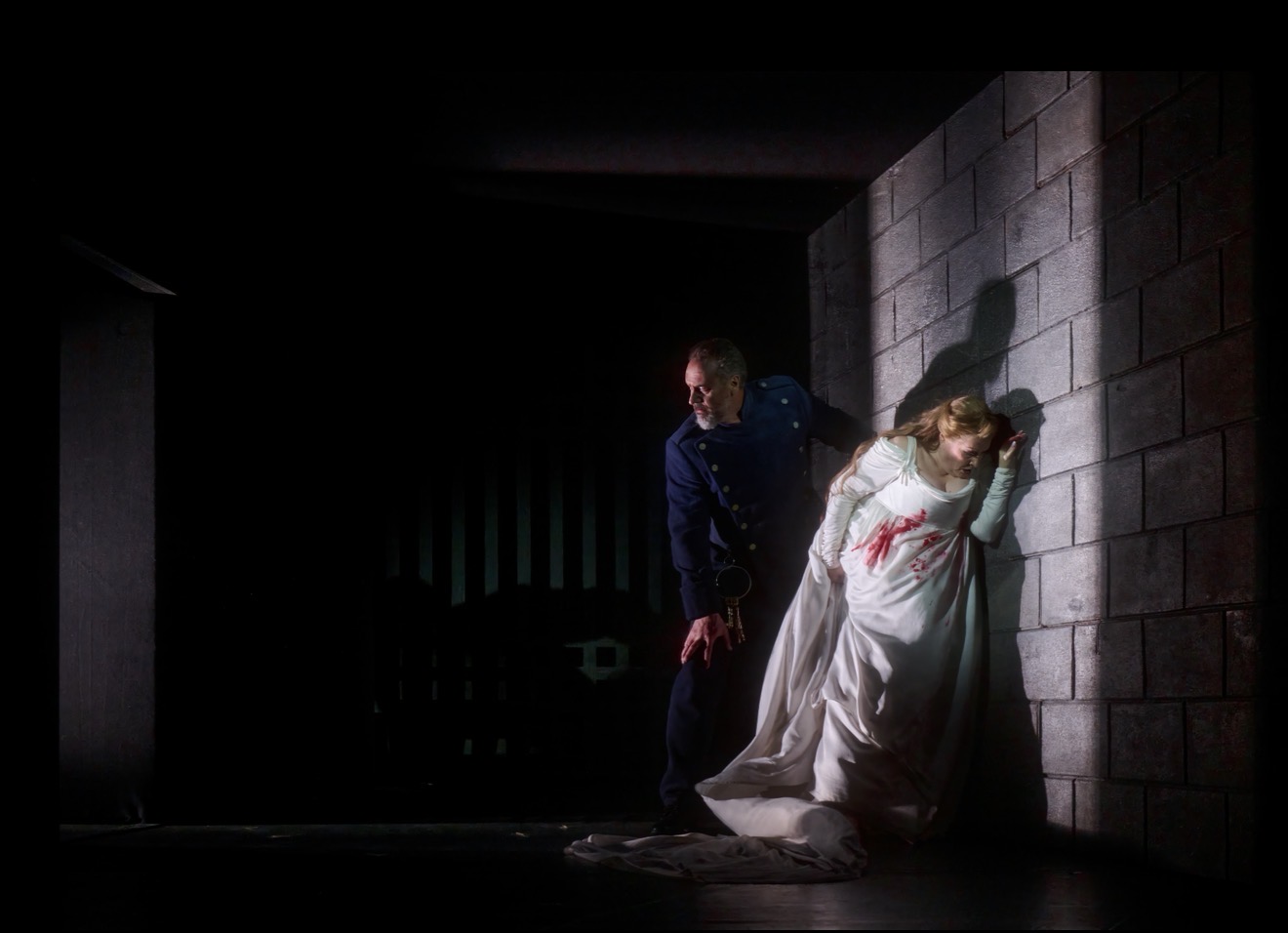 Christian Van Horn as Bluebeard and Karen Cargill as Judith beside a stone wall in the Canadian Opera Company’s Bluebeard’s Castle.