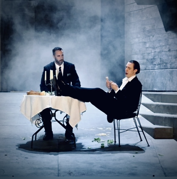 Christian Van Horn as Don Giovanni and another performer at a table in the Paris production