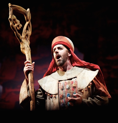 Christian Van Horn as Zaccaria singing while holding a staff at Seattle Opera.