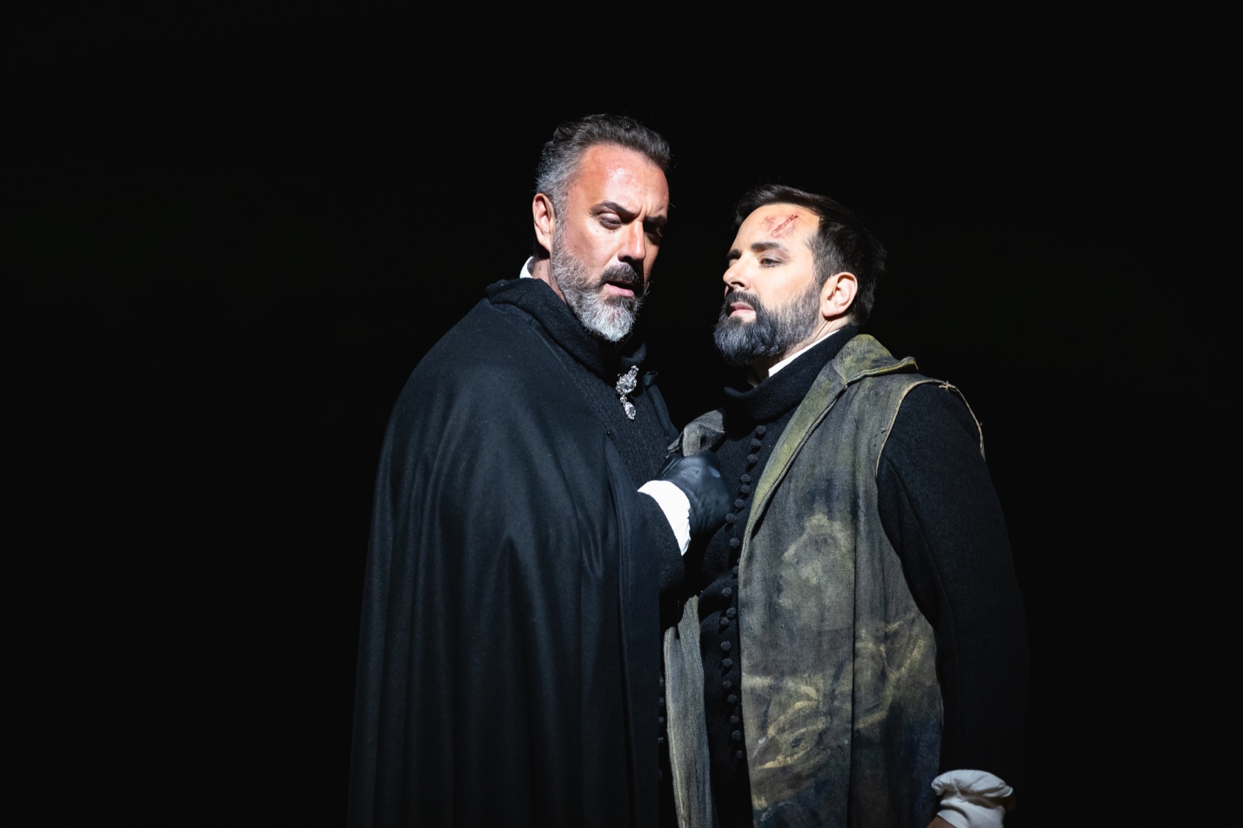Christian Van Horn as King Philip II in a close scene with another performer in Don Carlo at The Dallas Opera, 2026