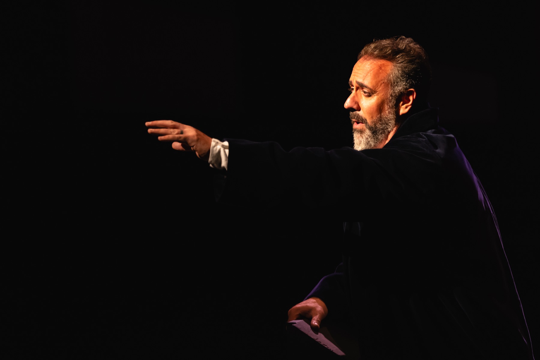 Christian Van Horn as King Philip II reaching across the stage in Don Carlo at The Dallas Opera, 2026