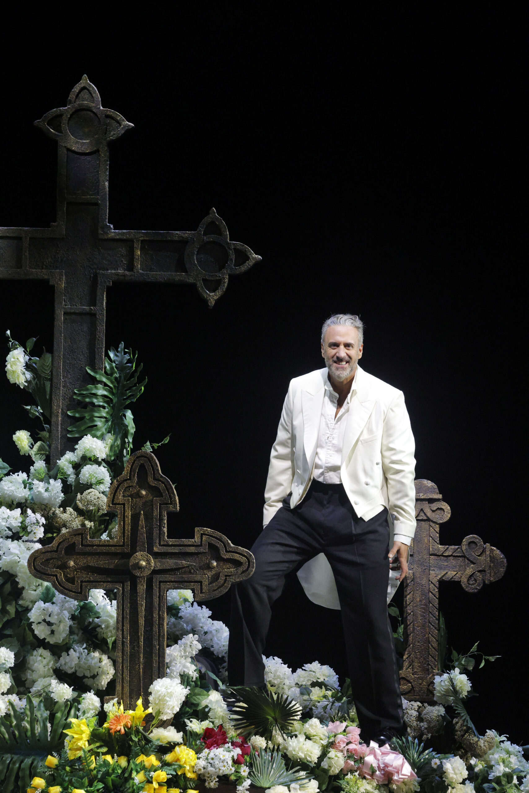 Christian Van Horn as Don Giovanni among graves and flowers at Lyric Opera of Chicago