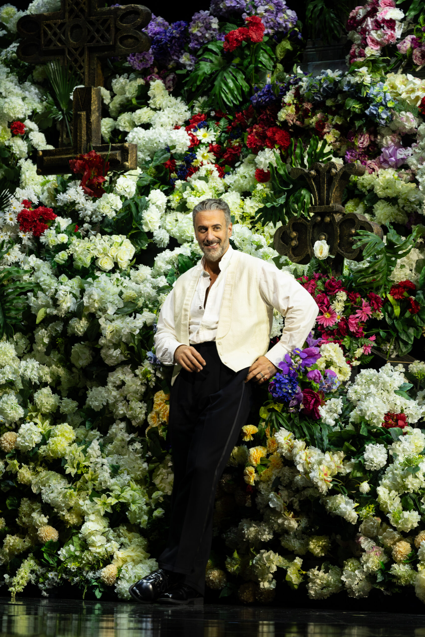 Christian Van Horn as Don Giovanni among flowers at Lyric Opera of Chicago